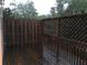 Enclosed wooden deck with a combination of solid wood and lattice fencing at 1186 Ridenour Blvd # 5, Kennesaw, GA 30152