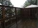 Enclosed wooden deck with a combination of solid wood and lattice fencing at 1186 Ridenour Blvd # 5, Kennesaw, GA 30152