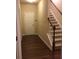 Inviting entryway featuring hardwood floors, stairs and a coat closet at 1186 Ridenour Blvd # 5, Kennesaw, GA 30152