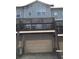 Back exterior view showing a multi-level deck and attached garages at 1186 Ridenour Blvd # 5, Kennesaw, GA 30152