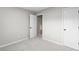 Bedroom with carpet, neutral walls, and white doors with black hardware at 191 Misty Ridge Trl, Stockbridge, GA 30281