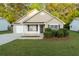 Charming single-story home featuring well-maintained landscaping and a cozy front porch at 191 Misty Ridge Trl, Stockbridge, GA 30281