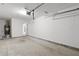 Clean, well-lit garage space with water heater and access door at 191 Misty Ridge Trl, Stockbridge, GA 30281