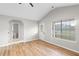 Open-concept living room featuring vaulted ceilings, wood flooring, and lots of natural light at 191 Misty Ridge Trl, Stockbridge, GA 30281