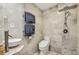 Modern bathroom featuring a sleek vanity, toilet, and shower with elegant tile work, offering a spa-like experience at 3311 Stillhouse Se Rd, Atlanta, GA 30339
