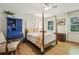 Charming bedroom featuring hardwood floors, a four-poster bed, and abundant natural light at 3311 Stillhouse Se Rd, Atlanta, GA 30339