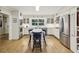 Well-lit kitchen with stainless steel appliances, a center island, and ample cabinet space for storage and functionality at 3311 Stillhouse Se Rd, Atlanta, GA 30339