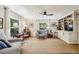 Inviting living room with bright windows, built-in shelving, and comfortable seating arrangements at 3311 Stillhouse Se Rd, Atlanta, GA 30339