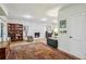 Cozy living room featuring a marble fireplace, wood floors, and ample natural light at 3311 Stillhouse Se Rd, Atlanta, GA 30339