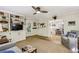 Inviting living room featuring custom built-ins, hardwood floors, and an open layout to the kitchen at 3311 Stillhouse Se Rd, Atlanta, GA 30339