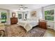 Bright bedroom with a large bed, multiple windows, and elegant decor, creating a cozy and inviting atmosphere at 3311 Stillhouse Se Rd, Atlanta, GA 30339