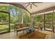 Inviting screened porch with comfortable seating and views of the surrounding greenery at 3311 Stillhouse Se Rd, Atlanta, GA 30339
