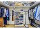 Organized walk-in closet with shelves, hanging rods, and ample storage for clothing and accessories at 3311 Stillhouse Se Rd, Atlanta, GA 30339
