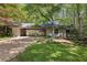 Charming home with a covered driveway and well-manicured lawn at 3311 Stillhouse Se Rd, Atlanta, GA 30339