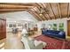 Spacious living room with hardwood floors, vaulted wood ceilings, and open floor plan at 3311 Stillhouse Se Rd, Atlanta, GA 30339