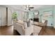 Comfortable living room with fireplace, stylish furniture, and ample natural light at 385 Russell Ridge Dr, Lawrenceville, GA 30043
