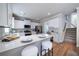 Updated kitchen with white cabinets, quartz countertops, and stainless steel appliances at 5424 Landsdowne Ct, Cumming, GA 30041