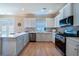 Well-equipped kitchen featuring stainless steel appliances and ample countertop space at 5424 Landsdowne Ct, Cumming, GA 30041