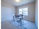 Bright office space featuring a large window, and a glass top desk with metal frame at 5424 Landsdowne Ct, Cumming, GA 30041