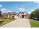 Beautiful brick home with mature landscaping, arched windows, and an attached garage at 5832 Sloane St, Douglasville, GA 30135