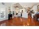 Open-concept living area featuring hardwood floors, a ceiling fan, and seamless flow at 5832 Sloane St, Douglasville, GA 30135