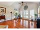 Bright living room with hardwood floors, large windows, and decorative accents at 5832 Sloane St, Douglasville, GA 30135