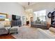 Open living area featuring high ceilings, neutral decor, and lots of natural light at 5832 Sloane St, Douglasville, GA 30135