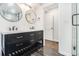 Double sink bathroom vanity features modern fixtures, matte black hardware, and an abundance of storage at 3423 Rugby Cir, Atlanta, GA 30337