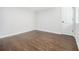 Spacious bedroom featuring hardwood floors, fresh white walls, and natural light at 3423 Rugby Cir, Atlanta, GA 30337