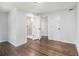 Bedroom featuring hardwood floors, white walls, and easy access to the ensuite bathroom at 3423 Rugby Cir, Atlanta, GA 30337
