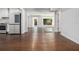 Dining area featuring hardwood flooring and a view into the kitchen and a large window at 3423 Rugby Cir, Atlanta, GA 30337