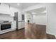 Bright kitchen with stainless steel appliances and hardwood floors is open to the living area at 3423 Rugby Cir, Atlanta, GA 30337
