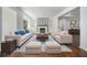 Bright living room featuring a fireplace, built-in shelving, and stylish furnishings on a patterned rug at 3423 Rugby Cir, Atlanta, GA 30337