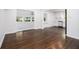 Open floor plan with hardwood flooring, featuring a view into the kitchen and other rooms at 3423 Rugby Cir, Atlanta, GA 30337