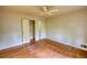 Bright bedroom featuring hardwood floors, a ceiling fan, and neutral walls, ready for personal touches at 2520 Overlook Ne Way, Atlanta, GA 30345