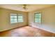 Bedroom with hardwood floors, ceiling fan and multiple windows with natural light at 2520 Overlook Ne Way, Atlanta, GA 30345