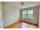 This bedroom features hardwood floors and a window with natural light at 2520 Overlook Ne Way, Atlanta, GA 30345