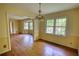 Dining room with a decorative chandelier, bright yellow walls, and hardwood flooring at 2520 Overlook Ne Way, Atlanta, GA 30345