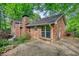 Charming brick home with a patio overlooking beautifully wooded grounds at 2520 Overlook Ne Way, Atlanta, GA 30345