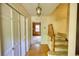 Spacious foyer with wood floors, classic lighting, and staircase to the upper level at 2520 Overlook Ne Way, Atlanta, GA 30345