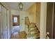 Welcoming foyer featuring hardwood floors, staircase, and view into the next room at 2520 Overlook Ne Way, Atlanta, GA 30345