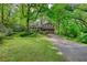 Picturesque view of a home with mature trees and a spacious driveway at 2520 Overlook Ne Way, Atlanta, GA 30345