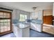 This kitchen features a stainless sink, electric stovetop and plenty of cabinet storage at 2520 Overlook Ne Way, Atlanta, GA 30345