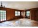 Cozy living room with wood-paneled walls, parquet floors, and bright windows at 2520 Overlook Ne Way, Atlanta, GA 30345