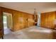 Living room featuring classic wood-paneled walls and carpeted flooring at 2520 Overlook Ne Way, Atlanta, GA 30345