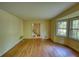 Spacious living room featuring hardwood floors and large bay windows overlooking the lush greenery at 2520 Overlook Ne Way, Atlanta, GA 30345