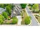 Aerial shot of sprawling home with well-maintained landscaping, long driveway, and lush trees at 3250 Twisted Branches Ln, Marietta, GA 30068