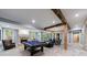Open basement design featuring a pool table, fireplace, and dining area at 3250 Twisted Branches Ln, Marietta, GA 30068