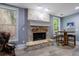 Basement with brick fireplace, large windows, and casual seating area at 3250 Twisted Branches Ln, Marietta, GA 30068