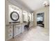 Bathroom vanity with granite countertops and decorative mirrors, creating a stylish and functional space at 3250 Twisted Branches Ln, Marietta, GA 30068